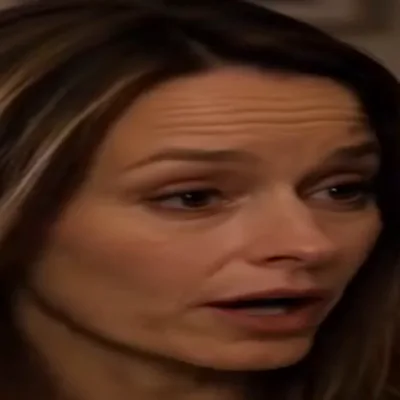 Elena — The mother torn between the newborn and the daughter upstairs