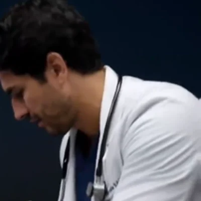 The Doctor — The physician treating the crashing patient in the ambulance scene