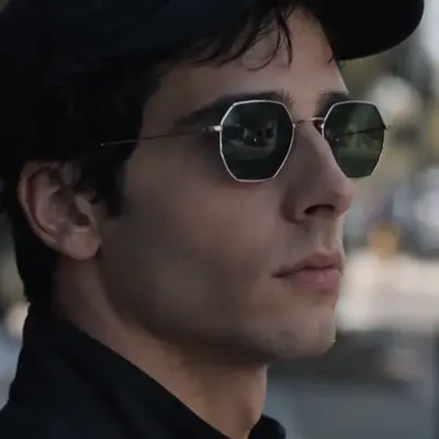 The Glassed Stranger — The watchful stranger who appears around the later broadcasts