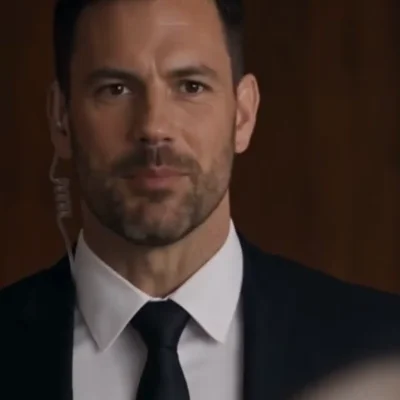 The Bodyguard — Pam's man — the calm observer