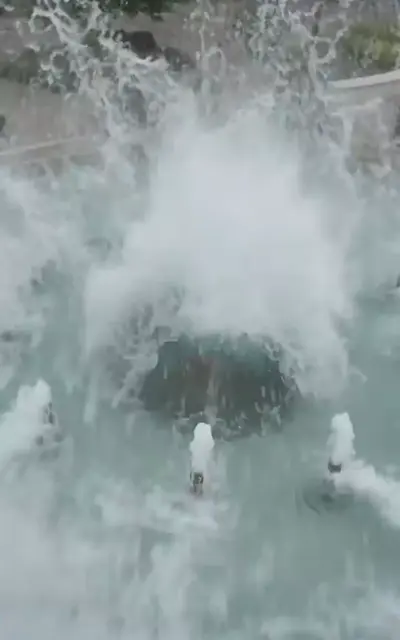 Water spray from Ariel's rescue near the bank