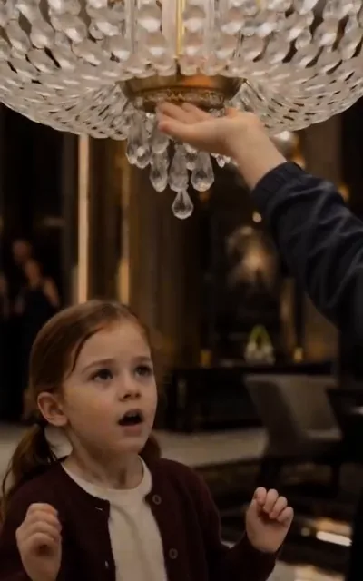The chandelier lifted mid-air