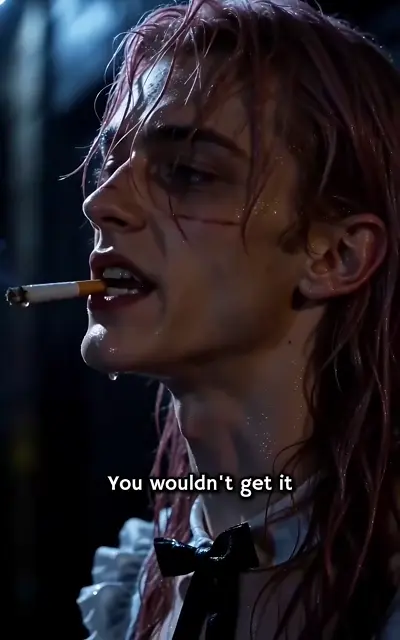 Eli smoking in the dark, wearing his numb expression