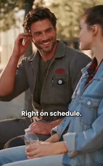 Claire in a work jacket and towel bows her head