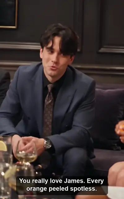James at a bar table with friends