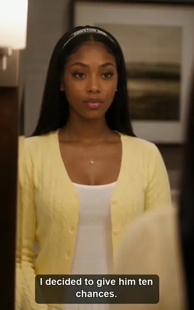 Sophia in a yellow cardigan indoors
