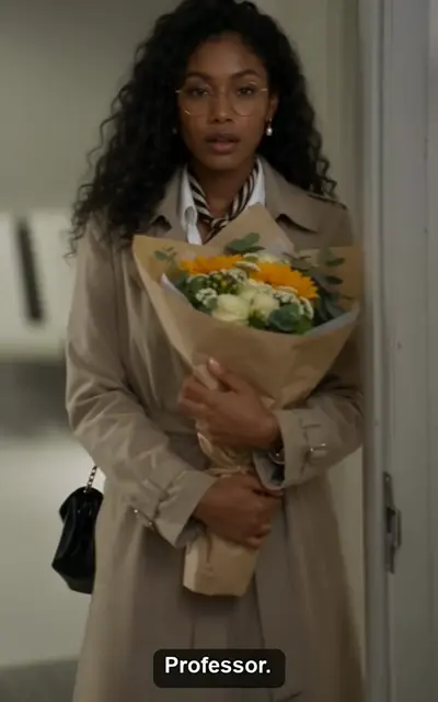 Sophia walks in holding flowers