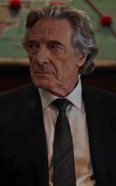 Grey-haired consigliere in the war council
