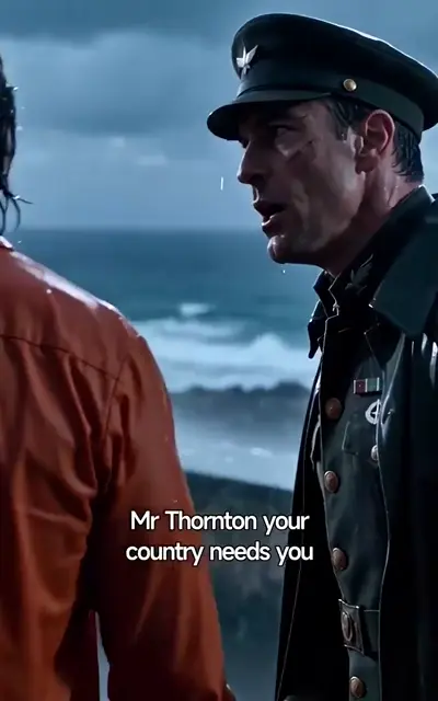 Thorne in a rain-streaked military coat stands by the sea