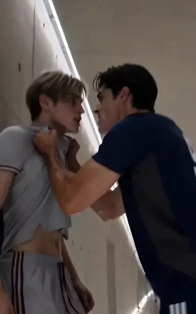 Julian shoving Liam against the tunnel wall