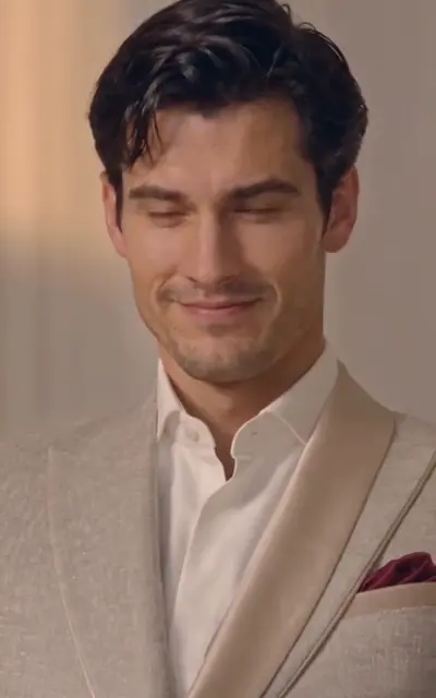 Evan closes his eyes in a cold half-smile