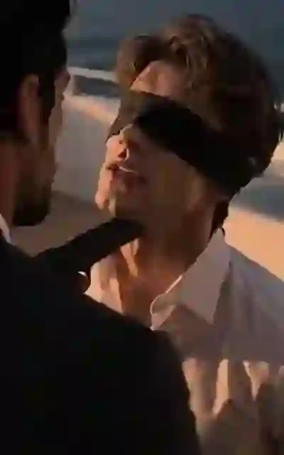 A gun held to the blindfolded lawyer's jaw