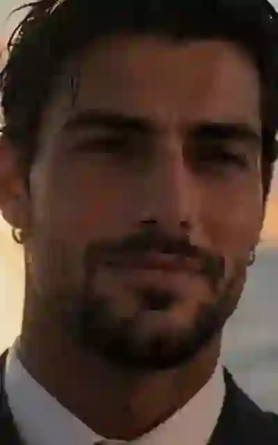Falcone's face in close-up on deck