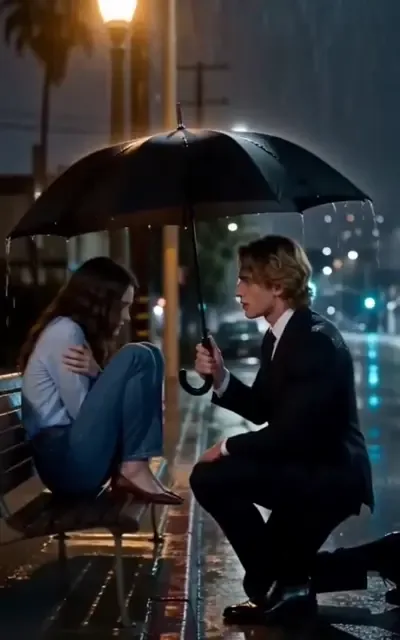Liam offering the umbrella