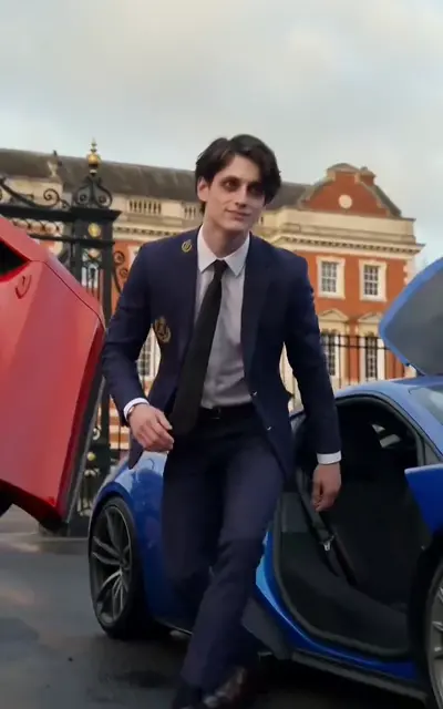 Fread stepping out of the sports car at the gate