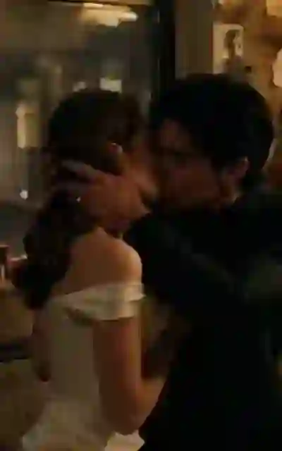 The two of them embracing indoors
