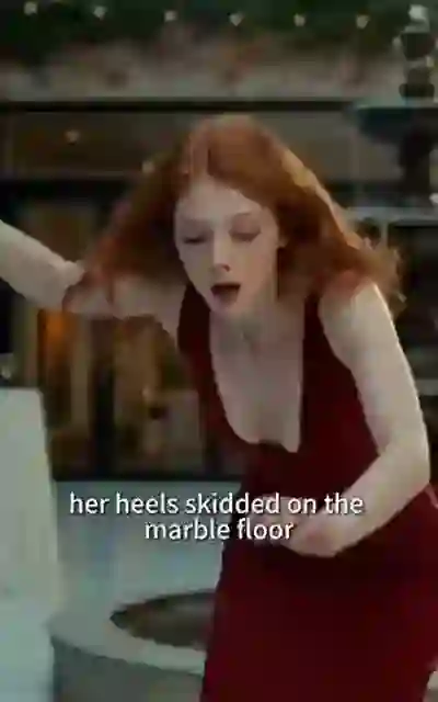 Tara in the red dress stumbling on the marble