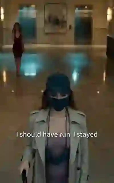 Sabrina masked and capped in the lobby