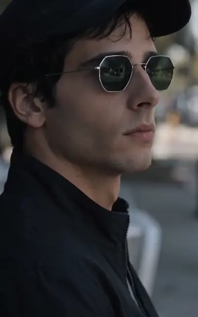 The glassed stranger in profile on a city street