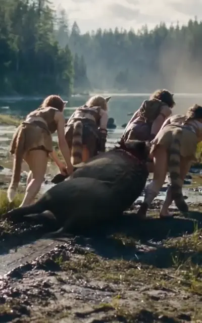 Beast-eared tribe members crouch around a fallen boar by a misty lake