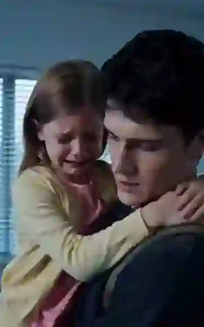 Ethan holding the crying girl close