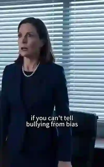 The teacher standing her ground by the blinds