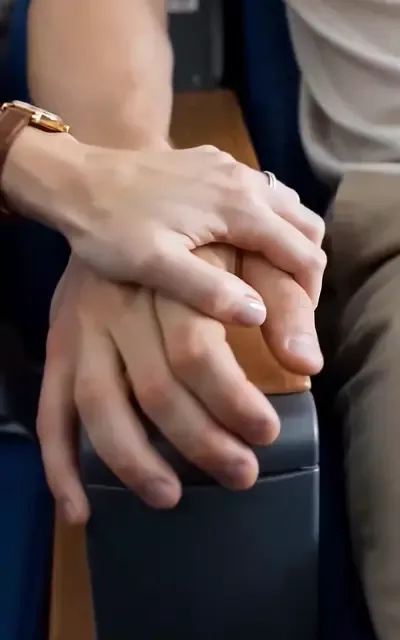 Hands locked on the armrest