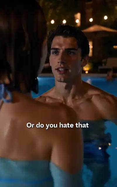 Harper faces the boy in the lit-up pool